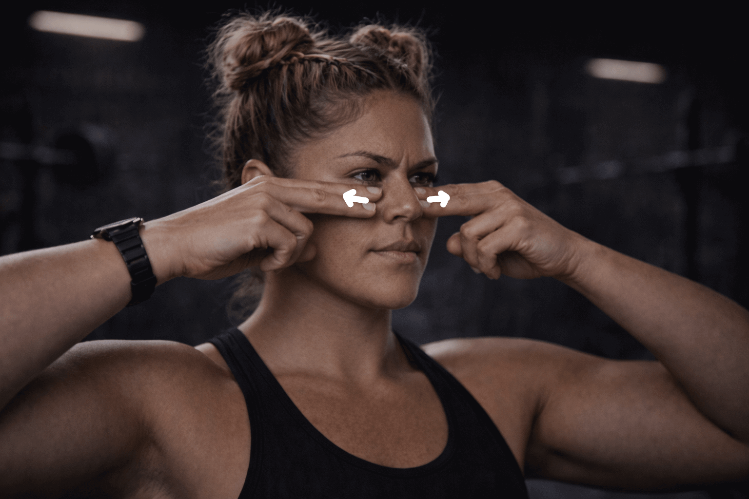 An athlete demonstrating the Cottle's Manoeuvre to test for a nasal restriction to see if she needs a nasal strip.