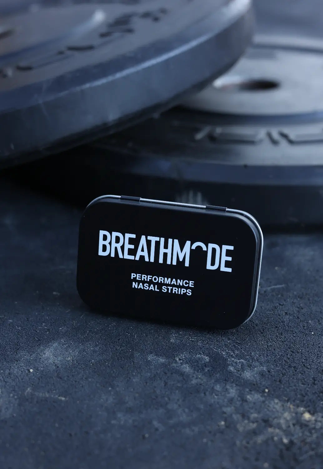 A close up image of BREATHMODE's premium, reusable performance nasal strips tin.