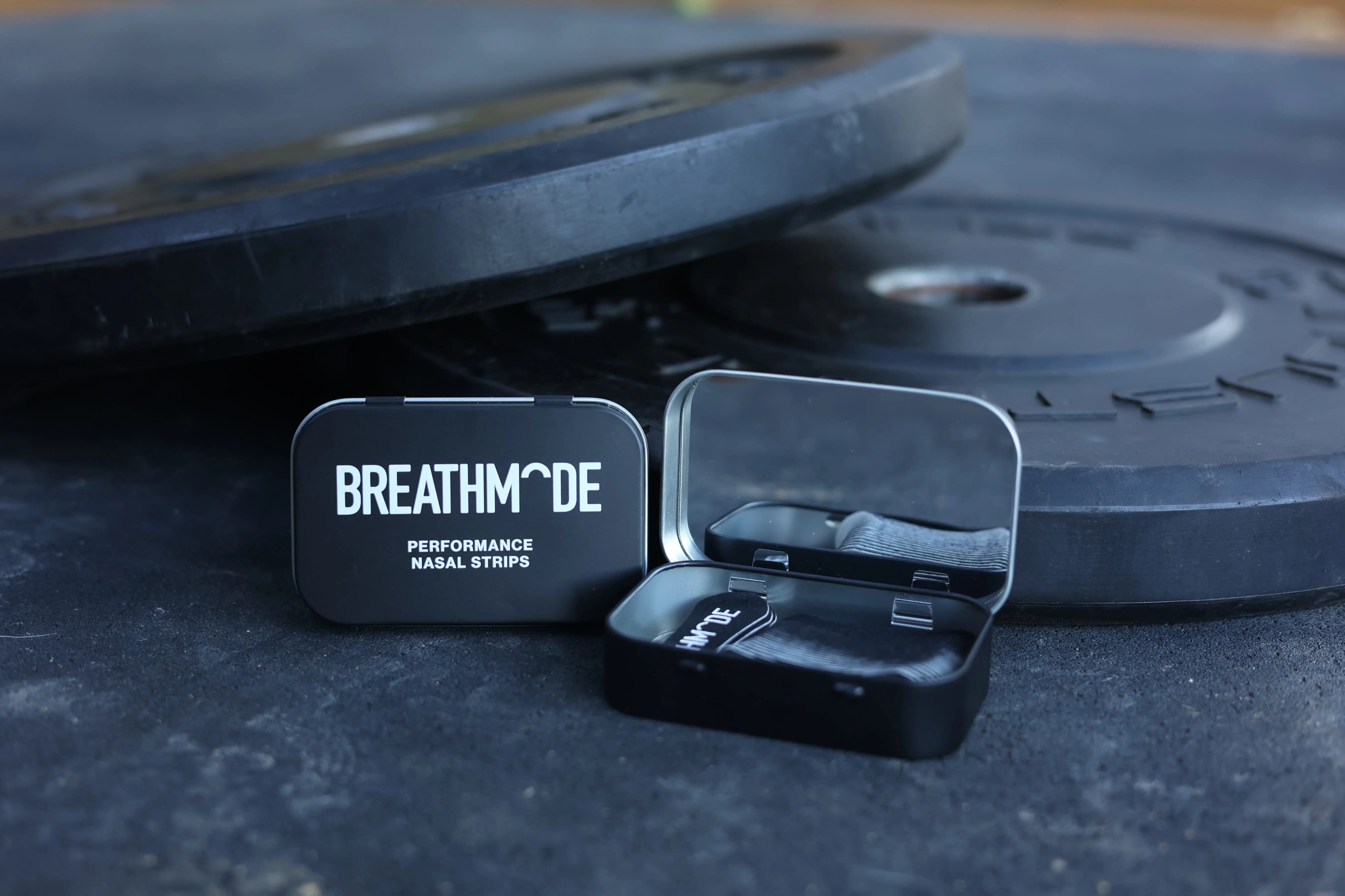 Two BREATHMODE performance nasal strip tins that are premium and reusable.