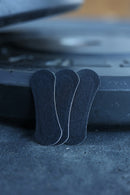 Three black BREATHMODE performance nasal strips 