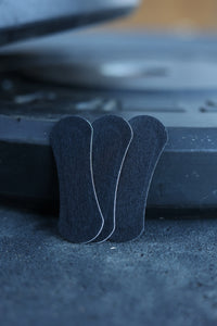 Three black BREATHMODE performance nasal strips 