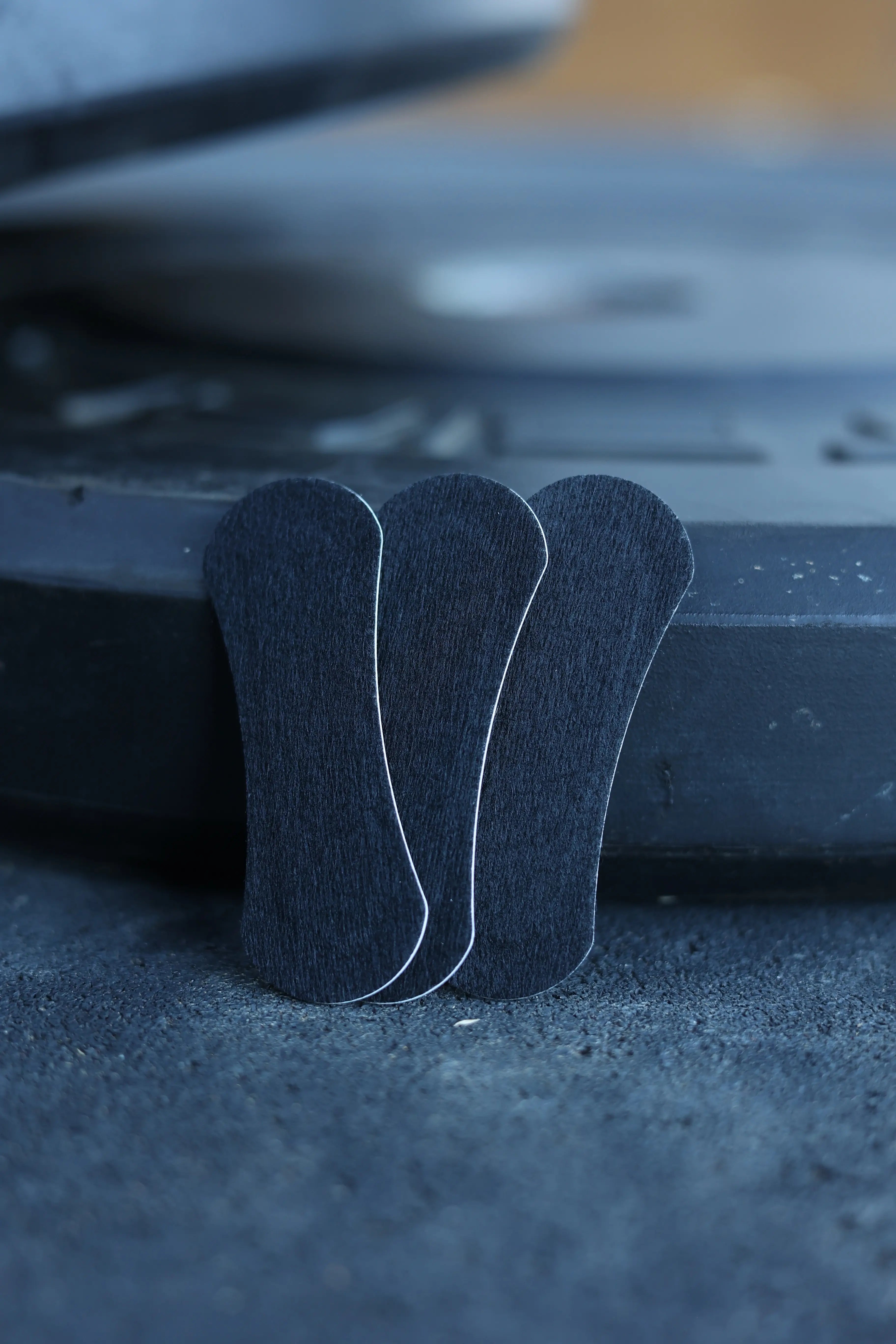 Three black BREATHMODE performance nasal strips 